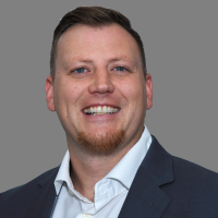 A headshot of Tommy Machun.